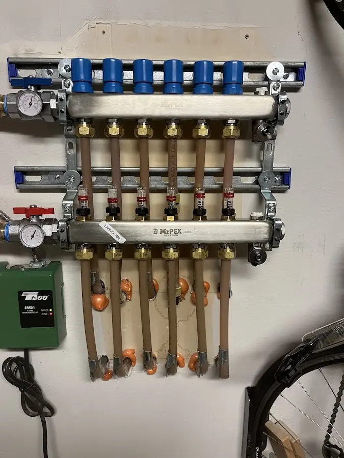 Plumber performing Water Heater Repair at a residential property in Irondequoit